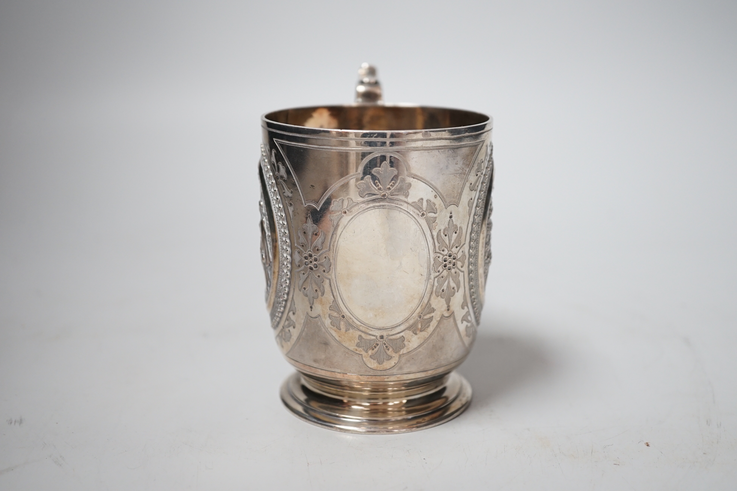 A Victorian silver christening can, with embossed panels, William & John Barnard, London, 1878, 92mm, 5.4oz.